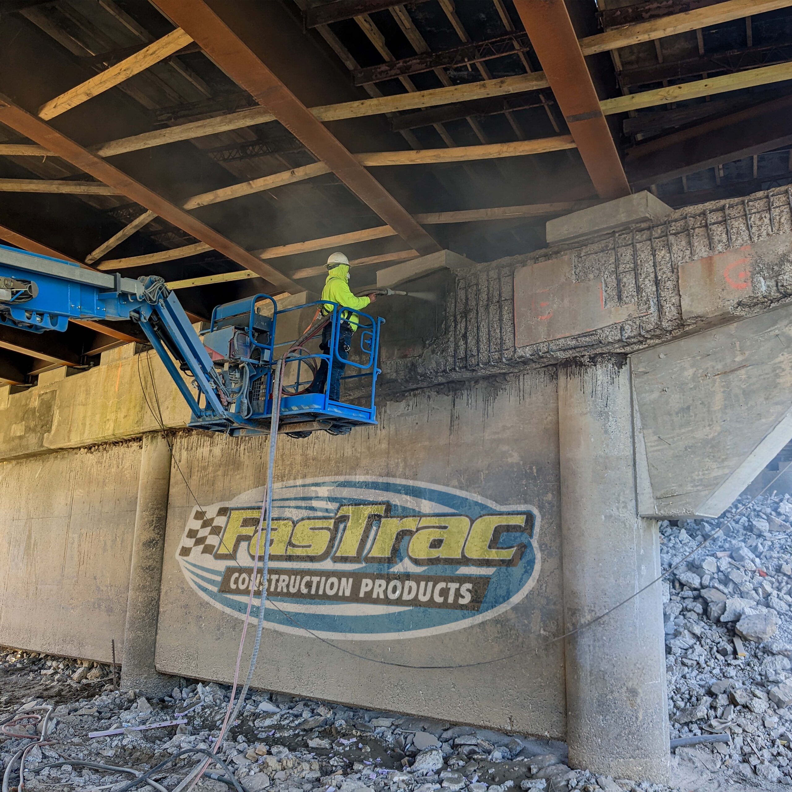Construction worker spraying FasTrac Shotcrete under a bridge in Oklahoma Construction worker spraying FasTrac Shotcrete under a bridge in Oklahoma