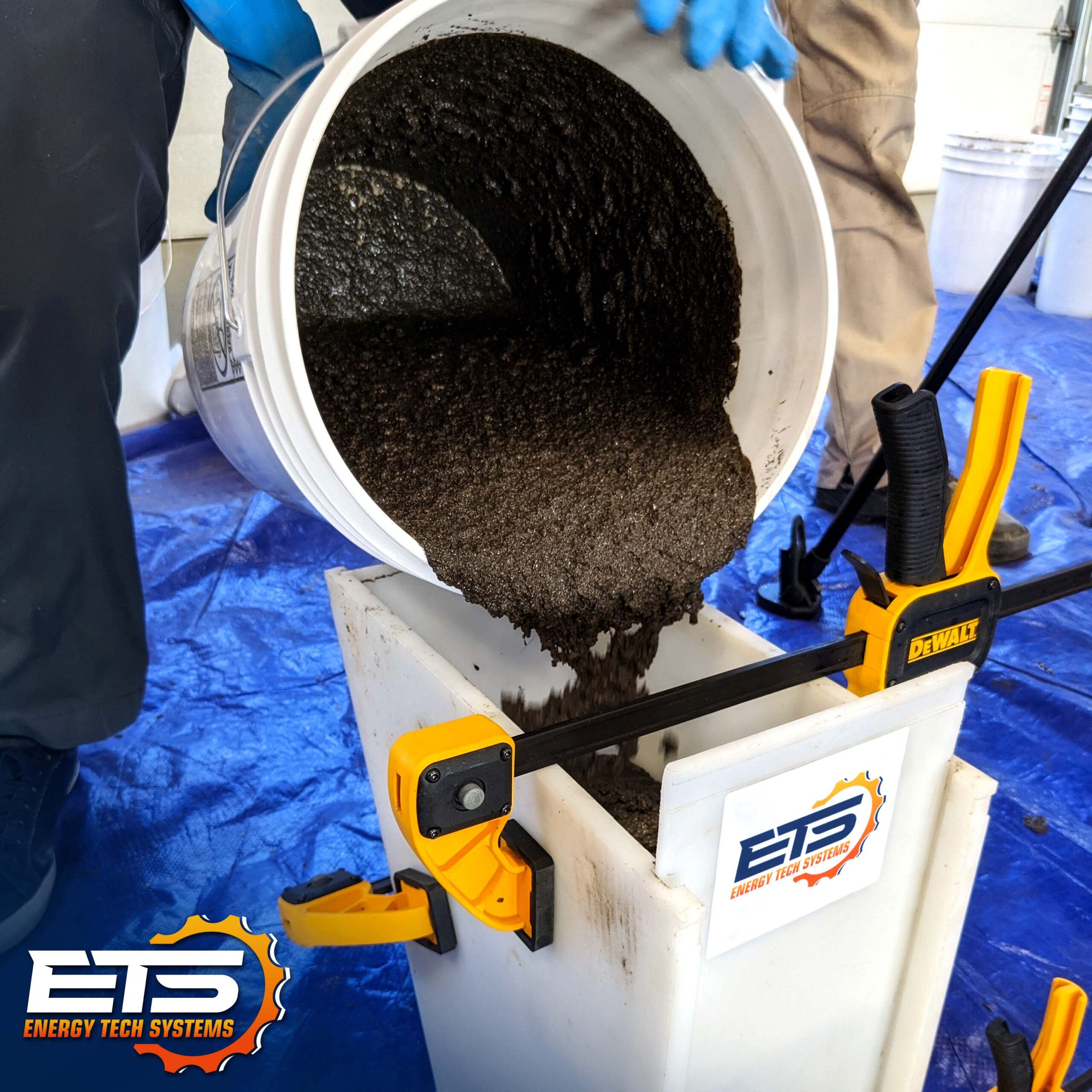 FasTrac CE815 Epoxy Grout being poured into flow box hopper FasTrac CE815 Epoxy Grout being poured into flow box hopper.