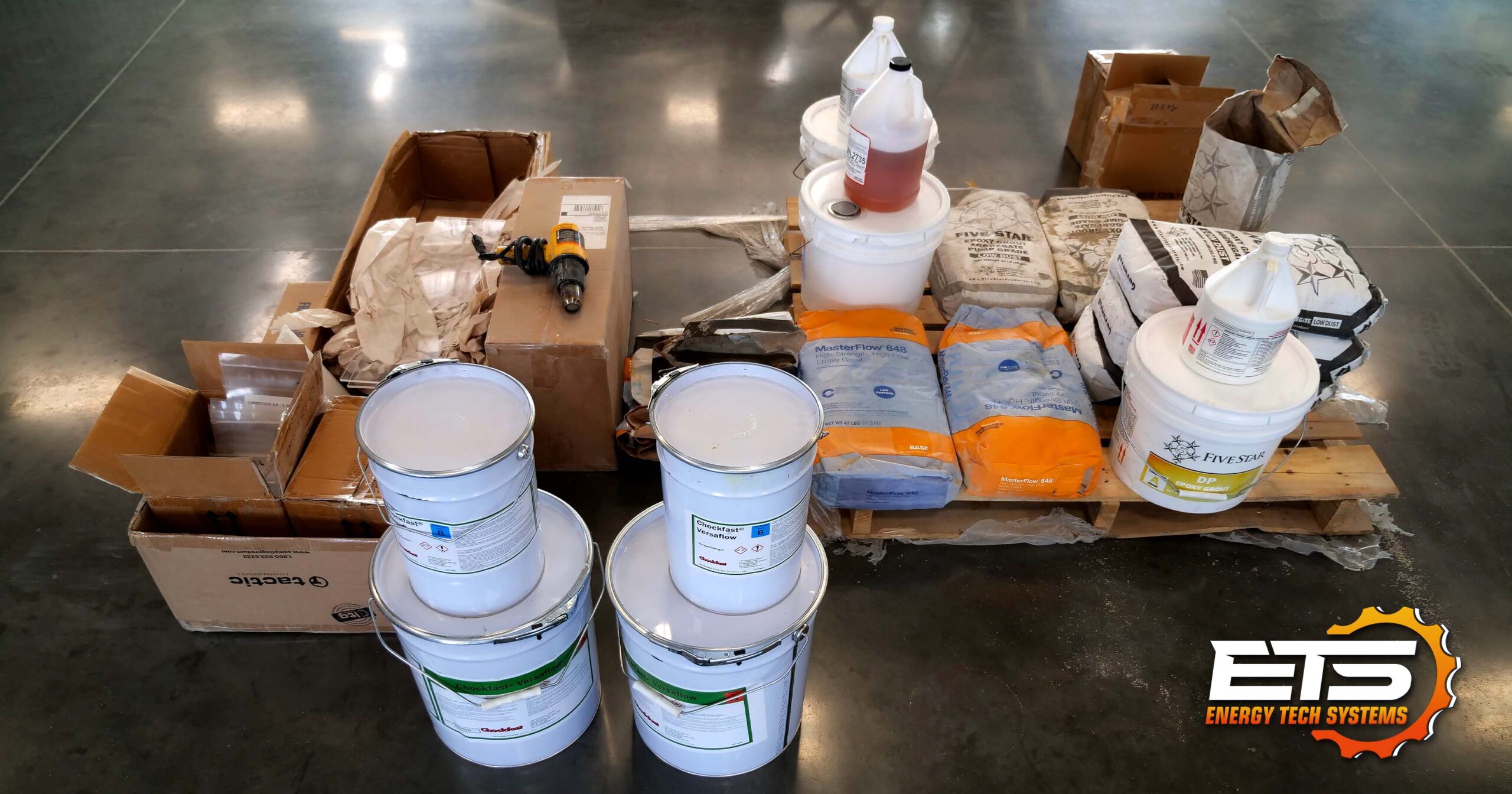 epoxy grout products ready for testing Several epoxy grout products in packaging ready for flow box testing.